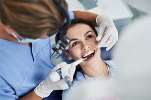 A dentist examining a patient's mouth