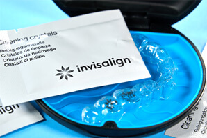 Invisalign cleaning crystals and Invisalign aligners in a hard case